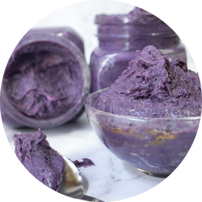 Jars and a glass bowl of thick ube spread